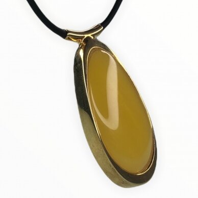 Yellow amber pendant with gold plated  silver