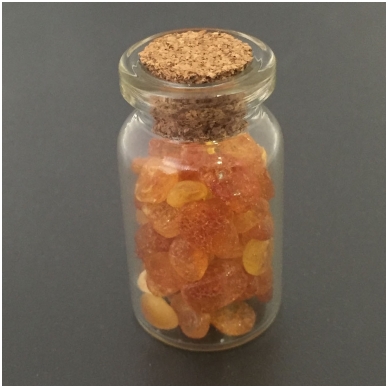 Amber pieces in a glass bottle