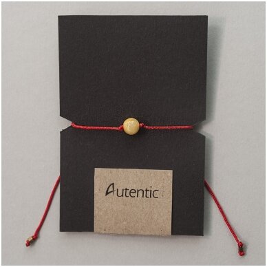 Red string with amber bead 3