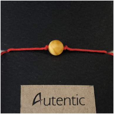 Red string with amber bead 2